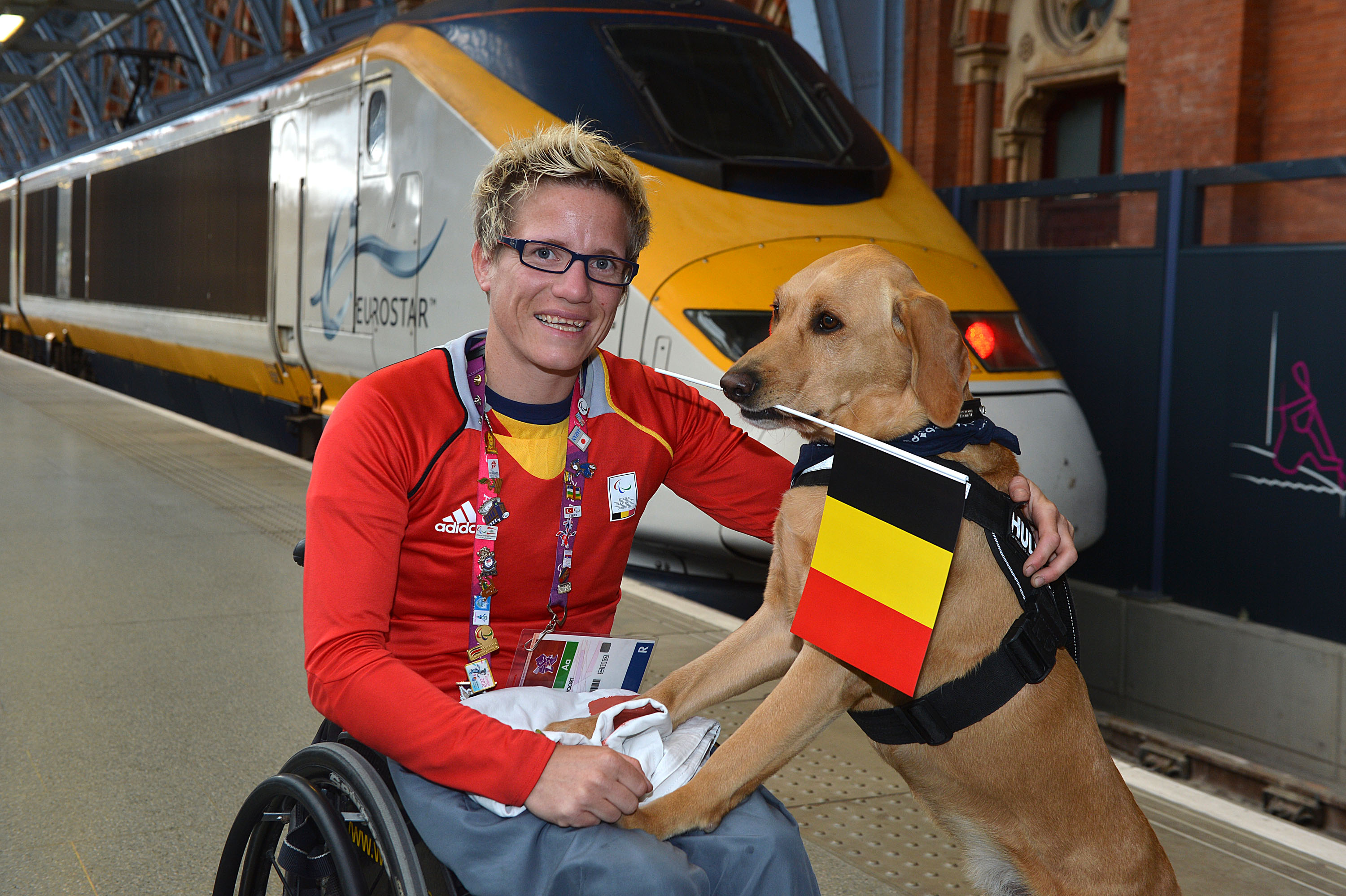 Belgian Paralympic 100m Gold and 200m Silver  medalist Marieke Vervoort and 'Help Hound' Zenn leave  the Eurostar terminal at  St. Pancras, London, UK, on Monday, Sept. 10, 2012. (Photo by Mark Allan/AP Images for Eurostar)